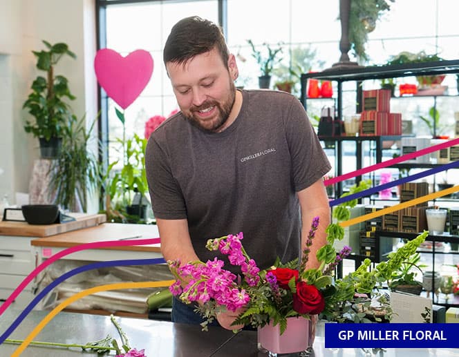 Florist making floral arrangement at GP Miller Floral Shop